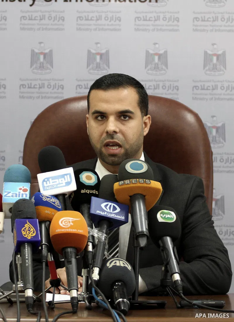 Eyad al-Bozm, the spokesman of the Palestinian Ministry of the Interior, speak during a press conference, in Gaza city November 7, 2014. At least 10 explosions hit houses and cars belonging to members of President Mahmou...