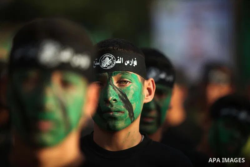 Young Palestinians from Hamas's "popular army" take part in a military graduation ceremony in Jabaliya refugee camp in the northern Gaza Strip November 7, 2014. Hamas recently formed a "popular army" for young Palestinia...