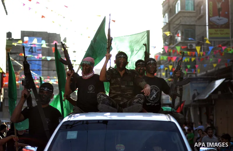 Young Palestinians from Hamas's "popular army" take part in a military graduation ceremony in Jabaliya refugee camp in the northern Gaza Strip November 7, 2014. Hamas recently formed a "popular army" for young Palestinia...