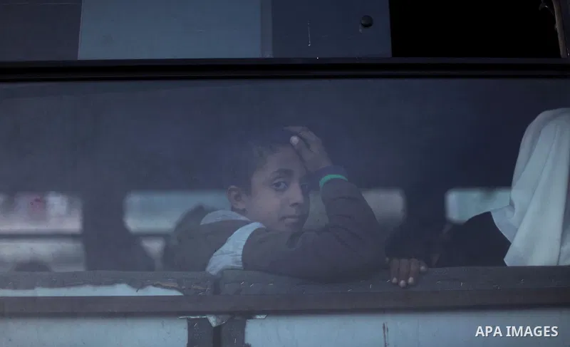 A Palestinian boy looks from a bus to the supporters of slamic Jihad movement during a ceremony in solidarity with Jerusalem and against the recent visits by Jewish activists to al-Aqsa mosque, in Gaza city November 7, 2...
