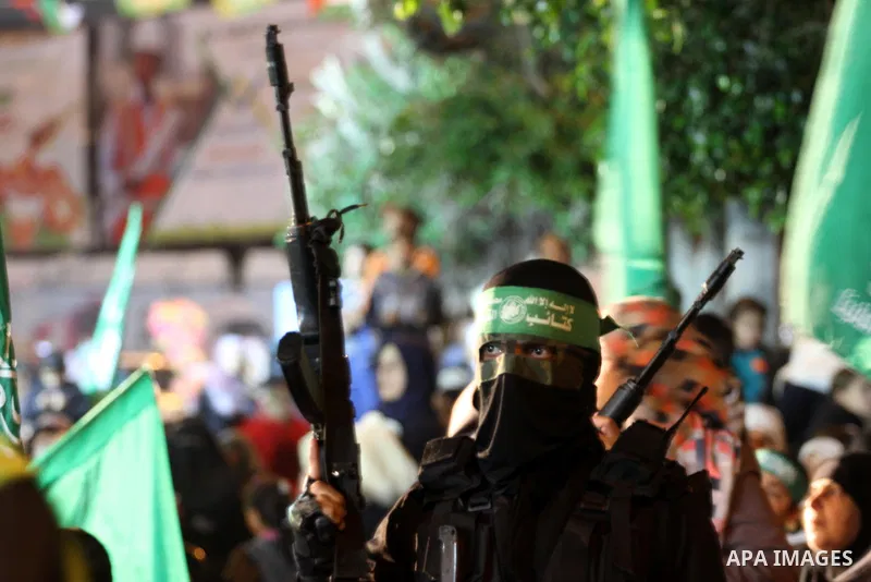 A Palestinian member of Ezzedeen al-Qassam, the armed wing of Hamas movement, participates in a memorial service for the Palestinians who were killed during the seven-week Israeli offensive, in Gaza city November 7, 2014...