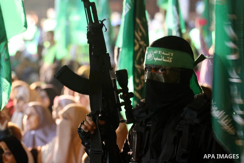 A Palestinian member of Ezzedeen al-Qassam, the armed wing of Hamas movement, participates in a memorial service for the Palestinians who were killed during the seven-week Israeli offensive, in Gaza city November 7, 2014...