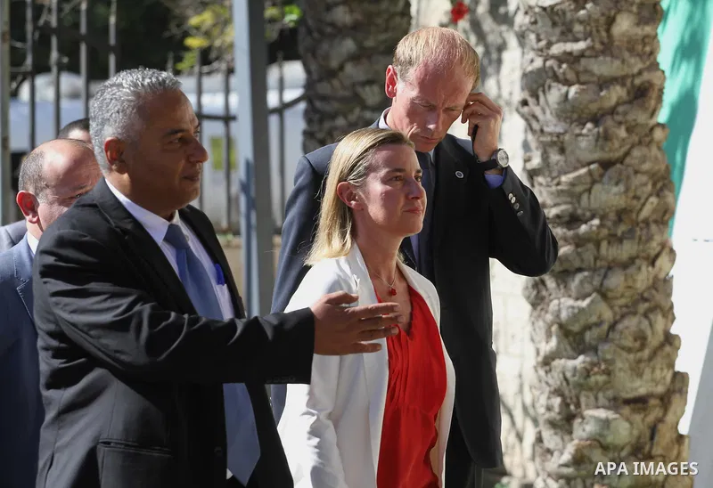 European Union foreign policy chief Federica Mogherini , stands with the Minister of the Palestinian government in front of the headquarters of the prime minister in Gaza City November 8, 2014. Photo by Mohammed Asad