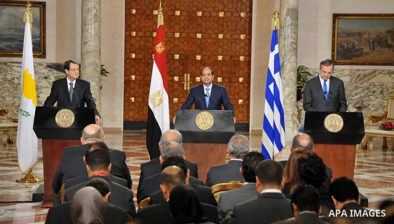 A handout picture released by the Egyptian Presidency shows Egypt's President Abdel Fattah al-Sisi speaks during a news conference with Cyprus' President Nicos Anastasiades and Greek Prime Minister Antonis Samaras after...