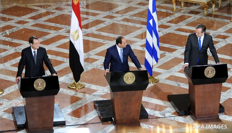 A handout picture released by the Egyptian Presidency shows Egypt's President Abdel Fattah al-Sisi speaks during a news conference with Cyprus' President Nicos Anastasiades and Greek Prime Minister Antonis Samaras after...