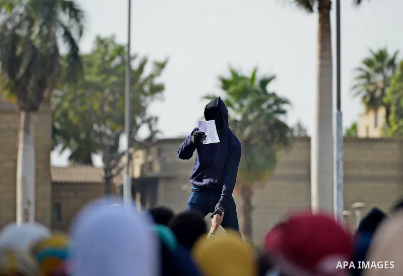 Egyptian students who support Muslim Brotherhood and ousted president Mohammed Morsi, shot slogans during a demonstration against military rule, at Cairo University, in Cairo, Nov. 09, 2014. Photo by Amr Sayed