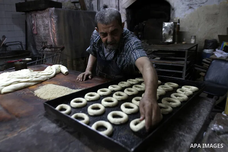 Palestinian baker Darwish Abu Samra, 77, bakes a traditional cake called 'Shami' at his old bakery in the old city of Nablus, West Bank, 02 November 2014. Abu Samra said his family started in this bakery in 1936 and sinc...