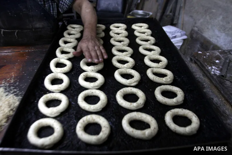 Palestinian baker Darwish Abu Samra, 77, bakes a traditional cake called 'Shami' at his old bakery in the old city of Nablus, West Bank, 02 November 2014. Abu Samra said his family started in this bakery in 1936 and sinc...