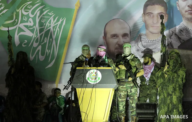 Abu Obaida, the spokesman for the Ezzedine Al-Qassam Brigades, Hamas's armed wing, speaks during an anti-Israel rally in Rafah in the southern Gaza Strip November 13, 2014. The rally was organized in memory of Hamas's mi...