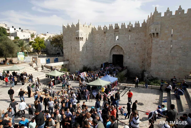 Palestinian worshippers walk outside the Dome of the Rock at the Al-Aqsa mosque compound after Friday prayers in the Old City of Jerusalem on November 14, 2014. Israel eased restrictions at Jerusalem's Al-Aqsa mosque aft...