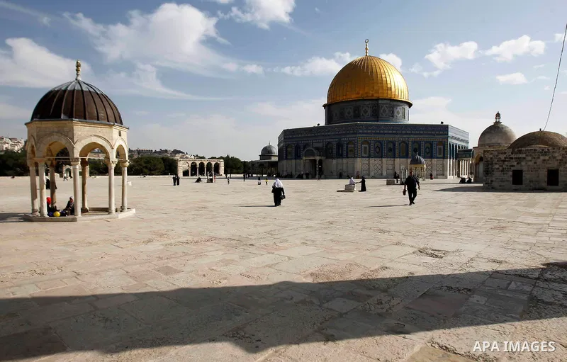 Palestinian worshippers walk outside the Dome of the Rock at the Al-Aqsa mosque compound after Friday prayers in the Old City of Jerusalem on November 14, 2014. Israel eased restrictions at Jerusalem's Al-Aqsa mosque aft...