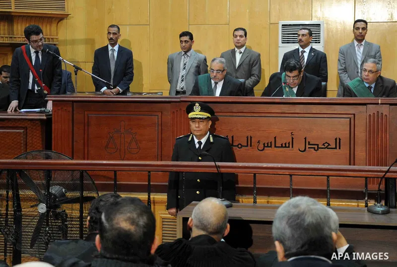 Egyptian Judges attend the trial of Egyptian members of Muslim Brotherhood at the court in Cairo on Nov. 15, 2014. Morsi is being tried at a courtroom in the Police Academy in New Cairo along with 14 others on charges of...