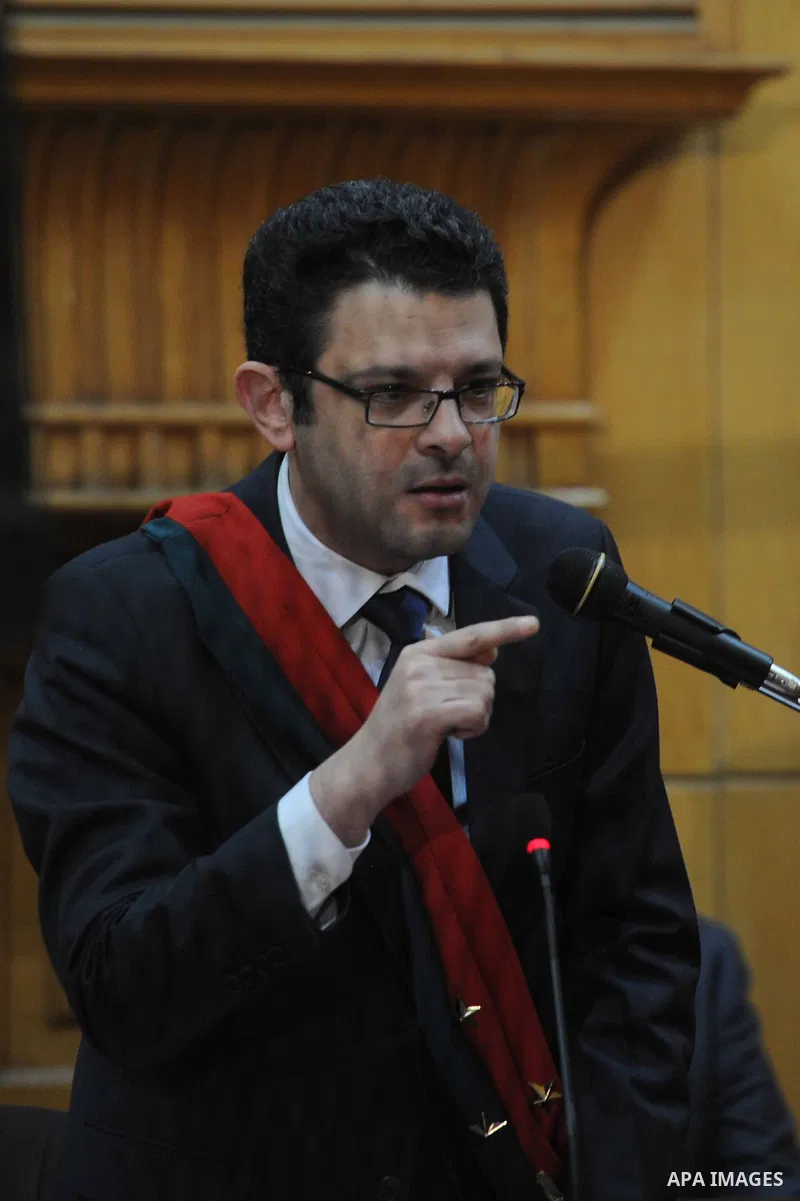Egyptian Judges attend the trial of Egyptian members of Muslim Brotherhood at the court in Cairo on Nov. 15, 2014. Morsi is being tried at a courtroom in the Police Academy in New Cairo along with 14 others on charges of...