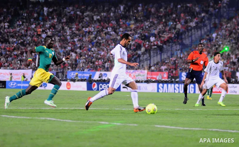 Egyptian players compete against with Senegal s players during their qualifying match of 2015 Africa Cup of Nations in Cairo, Egypt, on Nov. 15, 2014. Senegal won the match by 1-0. Photo by Amr Sayed