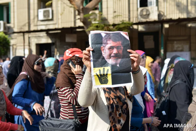 Egyptian students who support Muslim Brotherhood and ousted president Mohammed Morsi, take part in a demonstration to mark the World Student Day', in Cairo on November 17, 2014. The Students Against The Coup (SAC) moveme...