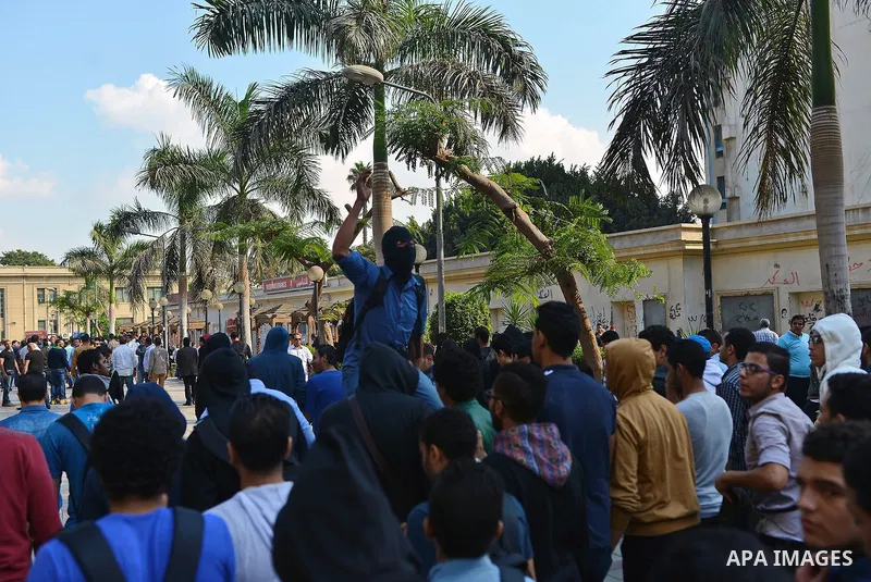 Egyptian students who support Muslim Brotherhood and ousted president Mohammed Morsi, take part in a demonstration to mark the World Student Day', in Cairo on November 17, 2014. The Students Against The Coup (SAC) moveme...
