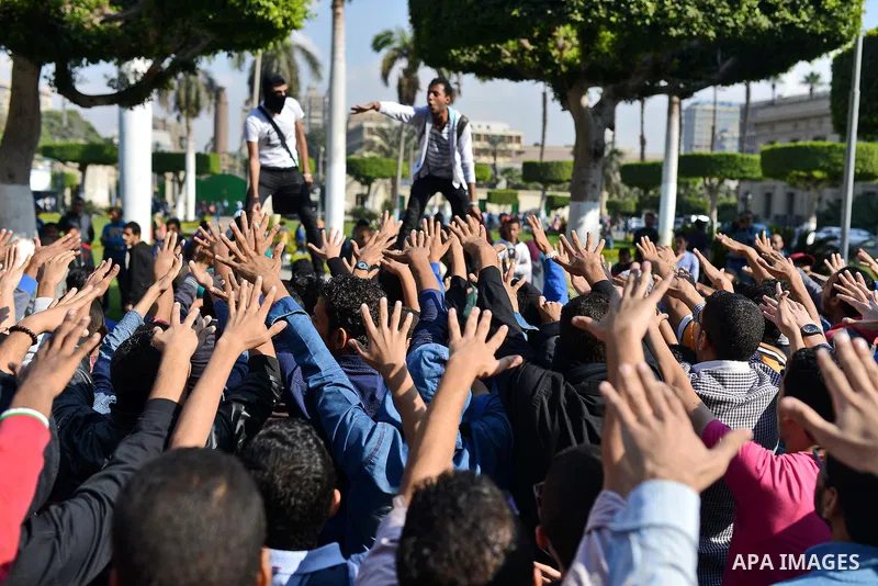 Egyptian students who support Muslim Brotherhood and ousted president Mohammed Morsi, take part in a demonstration to mark the World Student Day', in Cairo on November 17, 2014. The Students Against The Coup (SAC) moveme...