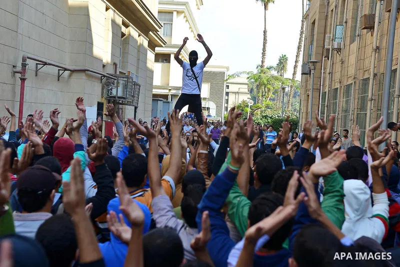Egyptian students who support Muslim Brotherhood and ousted president Mohammed Morsi, take part in a demonstration to mark the World Student Day', in Cairo on November 17, 2014. The Students Against The Coup (SAC) moveme...