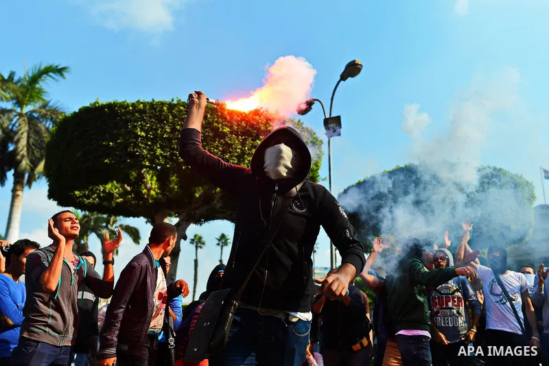 Egyptian students who support Muslim Brotherhood and ousted president Mohammed Morsi, take part in a demonstration to mark the World Student Day', in Cairo on November 17, 2014. The Students Against The Coup (SAC) moveme...