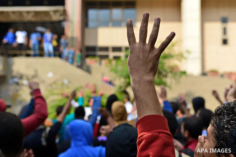 Egyptian students who support Muslim Brotherhood and ousted president Mohammed Morsi, take part in a demonstration to mark the World Student Day', in Cairo on November 17, 2014. The Students Against The Coup (SAC) moveme...