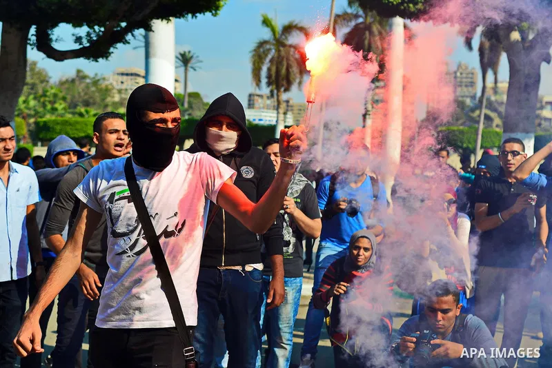 Egyptian students who support Muslim Brotherhood and ousted president Mohammed Morsi, take part in a demonstration to mark the World Student Day', in Cairo on November 17, 2014. The Students Against The Coup (SAC) moveme...