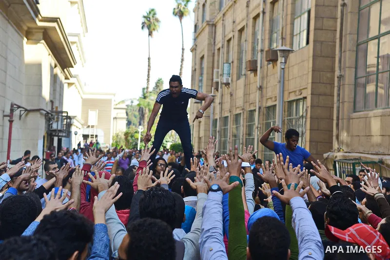 Egyptian students who support Muslim Brotherhood and ousted president Mohammed Morsi, take part in a demonstration to mark the World Student Day', in Cairo on November 17, 2014. The Students Against The Coup (SAC) moveme...