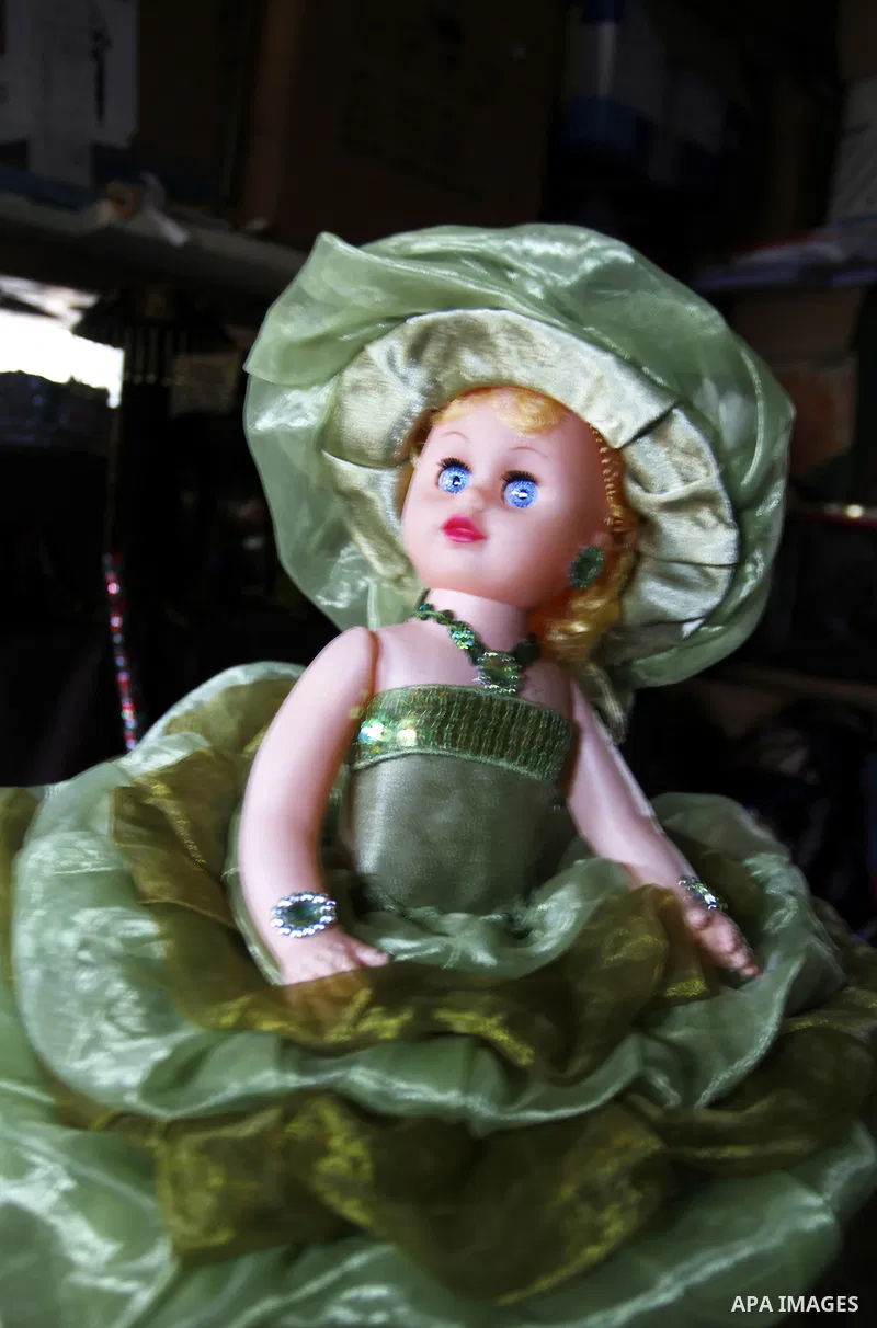 A handmade doll, made by 38 year-old Palestinian, Nesreen Abu Louz, is displayed at her home in Khan Younis, in the southern Gaza Strip, November 19, 2014. Abu Louz make different toys of dolls and cardboard models from...