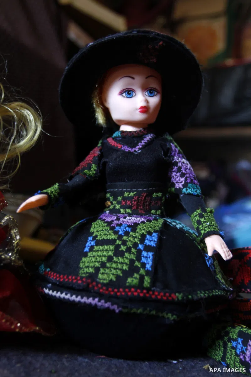 A handmade doll, made by 38 year-old Palestinian, Nesreen Abu Louz, is displayed at her home in Khan Younis, in the southern Gaza Strip, November 19, 2014. Abu Louz make different toys of dolls and cardboard models from...