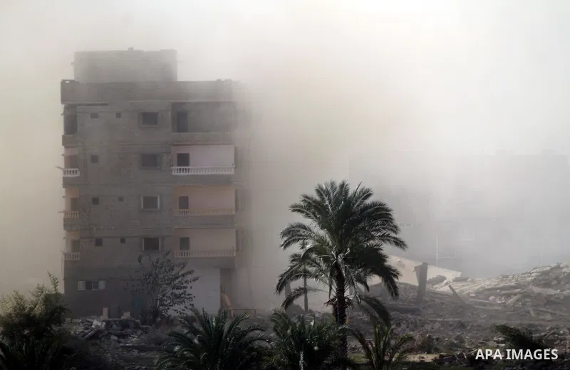 Smoke rises after a house was blown up during a military operation by Egyptian security forces in the Egyptian city of Rafah near the border with southern Gaza Strip on November 20, 2014. Egypt is set to expand the buffe...