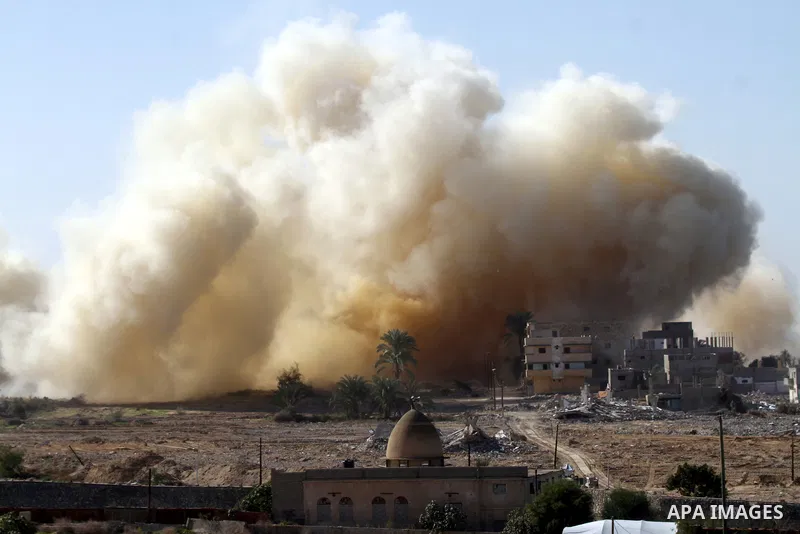 Smoke rises after a house was blown up during a military operation by Egyptian security forces in the Egyptian city of Rafah near the border with southern Gaza Strip on November 20, 2014. Egypt is set to expand the buffe...