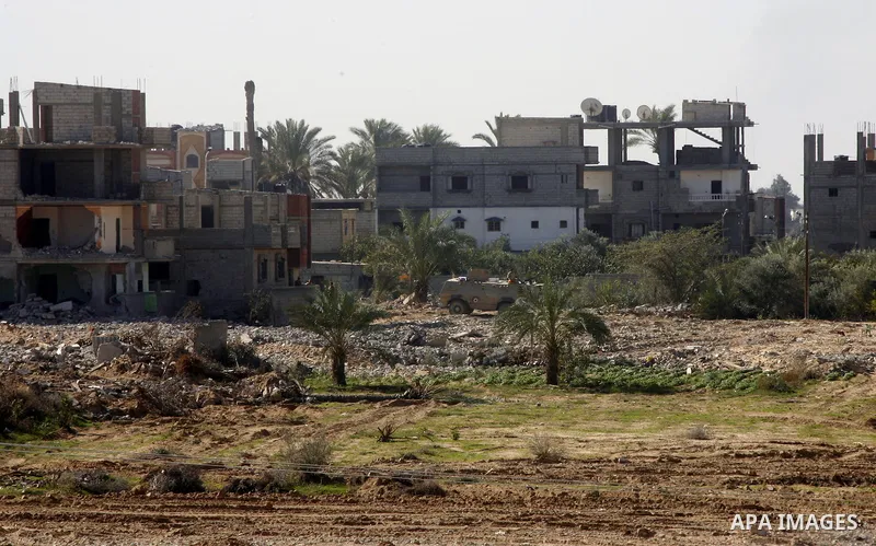 Egyptian security forces stand guard during a military operation by Egyptian security forces in the Egyptian city of Rafah near the border with southern Gaza Strip on November 20, 2014. Egypt is set to expand the buffer...