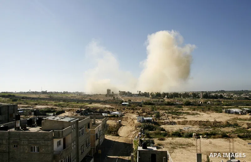 Smoke rises after a house was blown up during a military operation by Egyptian security forces in the Egyptian city of Rafah near the border with southern Gaza Strip on November 20, 2014. Egypt is set to expand the buffe...