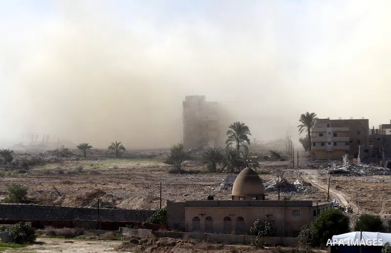 Smoke rises after a house was blown up during a military operation by Egyptian security forces in the Egyptian city of Rafah near the border with southern Gaza Strip on November 20, 2014. Egypt is set to expand the buffe...