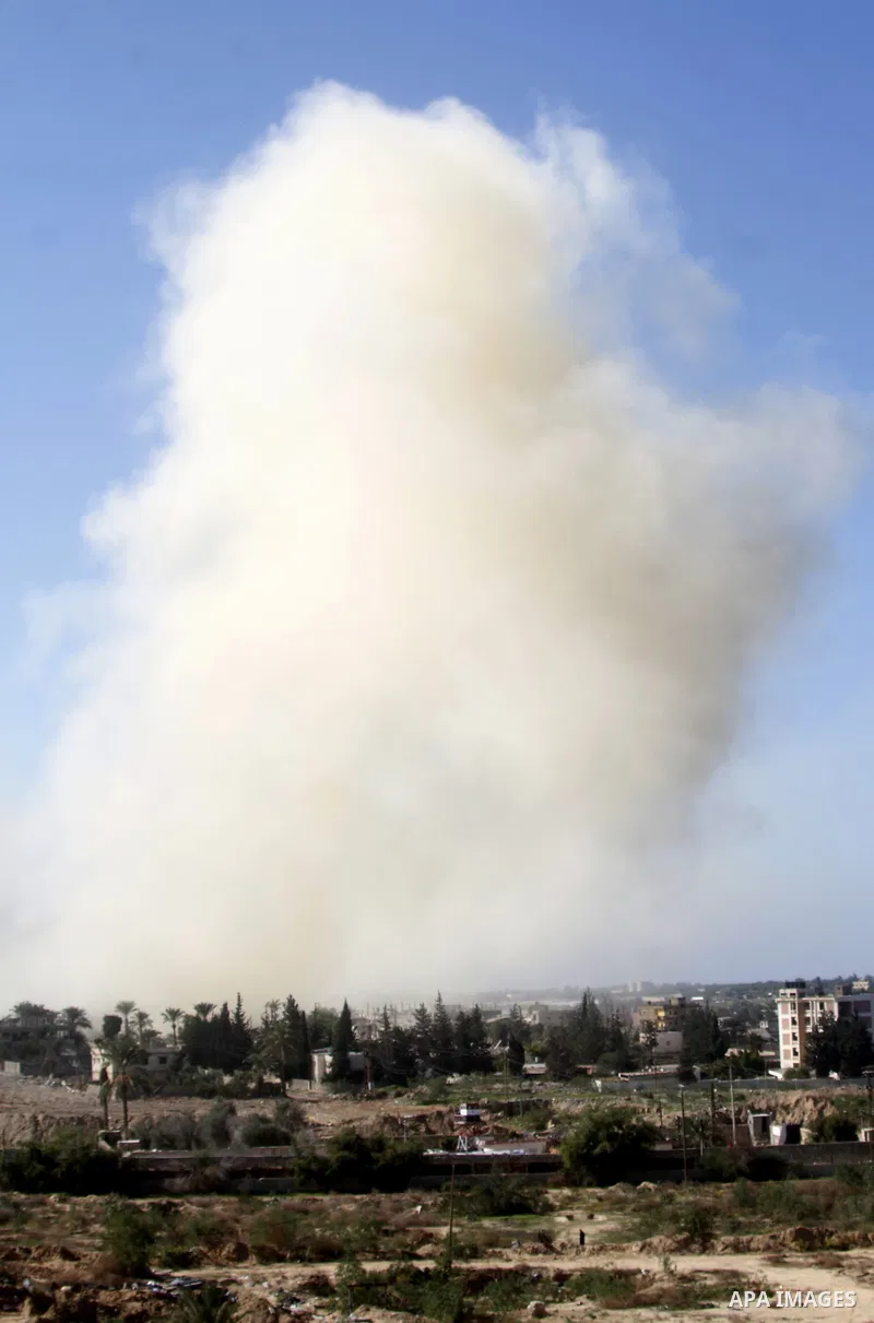 Smoke rises after a house was blown up during a military operation by Egyptian security forces in the Egyptian city of Rafah near the border with southern Gaza Strip on November 20, 2014. Egypt is set to expand the buffe...