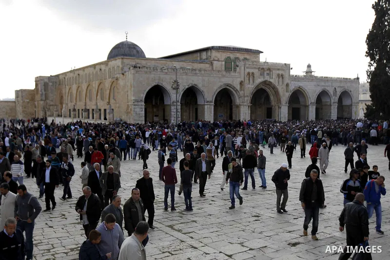 Palestinian worshippers walk at the Al-Aqsa mosque compound following Friday prayers in the Old City of Jerusalem on November 21, 2014. Israel eased age restrictions for Friday prayers at Jerusalem's flashpoint Al-Aqsa m...