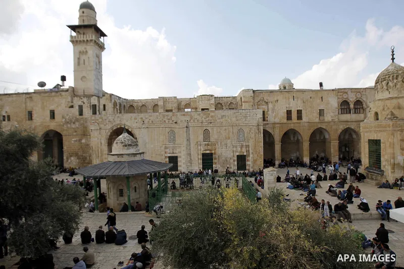 Palestinian worshippers walk at the Al-Aqsa mosque compound following Friday prayers in the Old City of Jerusalem on November 21, 2014. Israel eased age restrictions for Friday prayers at Jerusalem's flashpoint Al-Aqsa m...