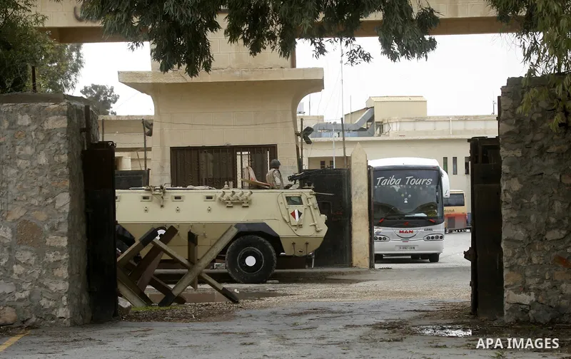 An Egyptian soldier stands guard, as Palestinians returning to Gaza, arrive at the Rafah border crossing between Egypt and southern Gaza Strip November 26, 2014. Egypt reopened the Rafah crossing with Gaza, which is the...
