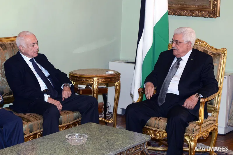 Palestinian President Mahmoud Abbas (R) meets with Arab League General Secretary Nabil al-Arabi, in Cairo on November 28, 2014. Photo by Thaer Ganaim