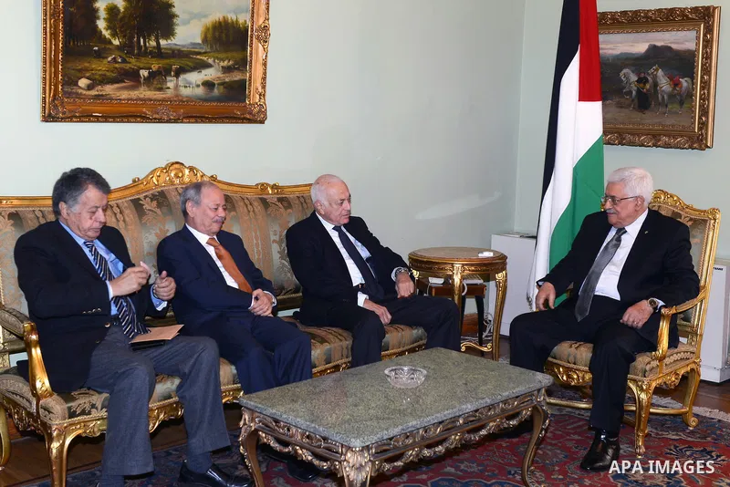 Palestinian President Mahmoud Abbas (R) meets with Arab League General Secretary Nabil al-Arabi, in Cairo on November 28, 2014. Photo by Thaer Ganaim