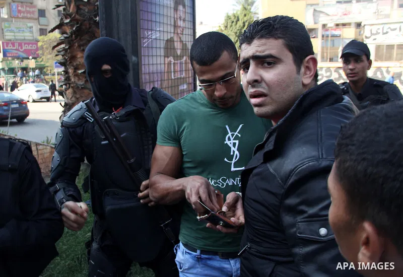 Egyptian police arrest a protester who support Muslim Brotherhood during a protest on al-Haram Street, Cairo, Egypt, 28 November 2014. According to unconfirmed reports at least two Egyptian army officers have been killed...