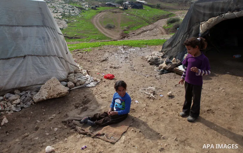 Bedouin children play outside family's dwellings in the Jordan Valley near West Bank city of Jericho on November 29, 2014. Photo by Shadi Hatem