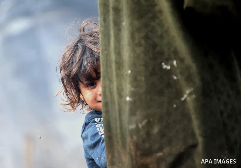 A Bedouin girl plays outside her family's dwellings in the Jordan Valley near West Bank city of Jericho on November 29, 2014. Photo by Shadi Hatem