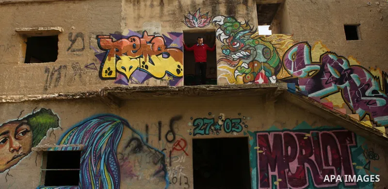 A Bedouin stands in the doorway in building in the Jordan Valley near West Bank city of Jericho on November 29, 2014. Photo by Shadi Hatem