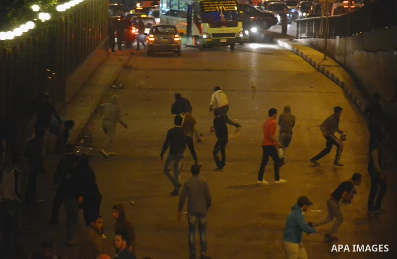 Egyptian anti-Mubarak protesters clash with riot police at Abdel Moneim Riad, a main transportation hub for taxis and buses, after hearing the verdict of former Egyptian president Hosni Mubarak, in Cairo, Egypt, 29 Novem...