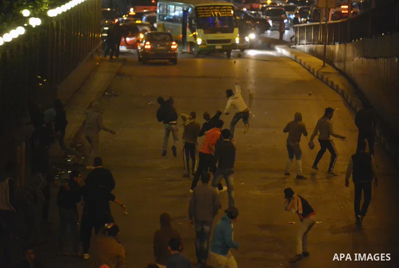 Egyptian anti-Mubarak protesters clash with riot police at Abdel Moneim Riad, a main transportation hub for taxis and buses, after hearing the verdict of former Egyptian president Hosni Mubarak, in Cairo, Egypt, 29 Novem...