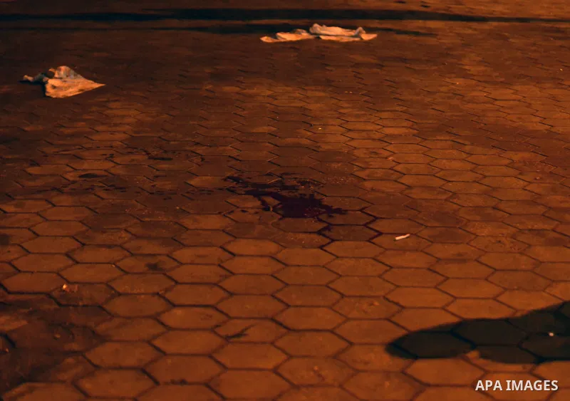A blood stain is seen on the ground following disperse an anti-Mubarak protest Egyptian riot police at Abdel Moneim Riad, a main transportation hub for taxis and buses, after hearing the verdict of former Egyptian presid...