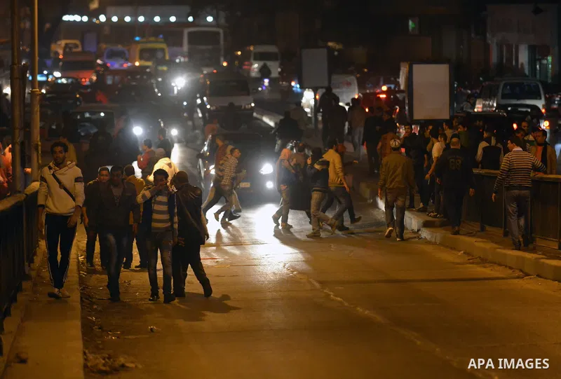 Egyptian anti-Mubarak protesters clash with riot police at Abdel Moneim Riad, a main transportation hub for taxis and buses, after hearing the verdict of former Egyptian president Hosni Mubarak, in Cairo, Egypt, 29 Novem...