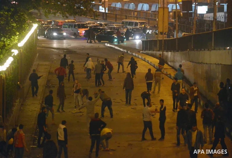 Egyptian anti-Mubarak protesters clash with riot police at Abdel Moneim Riad, a main transportation hub for taxis and buses, after hearing the verdict of former Egyptian president Hosni Mubarak, in Cairo, Egypt, 29 Novem...