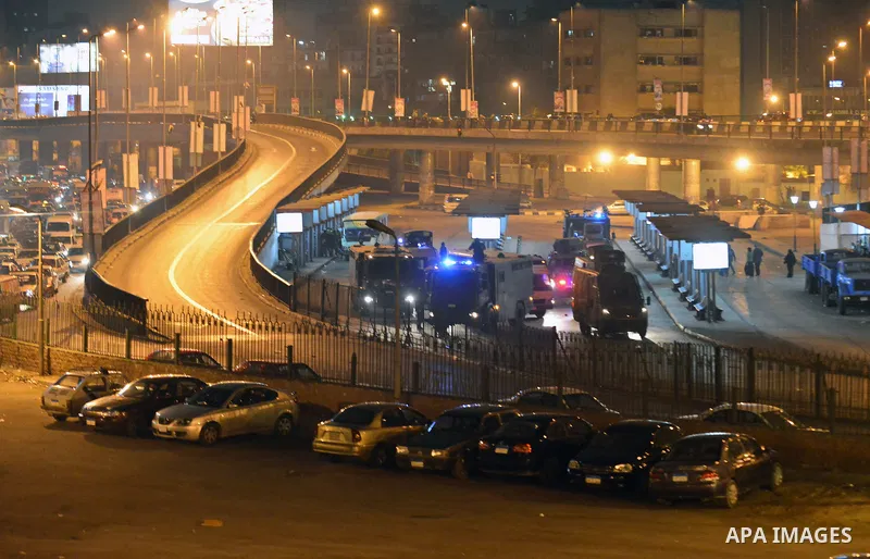 Egyptian riot police stand guard after disperse anti-Mubarak protesters at Abdel Moneim Riad, a main transportation hub for taxis and buses, after hearing the verdict of former Egyptian president Hosni Mubarak, in Cairo,...