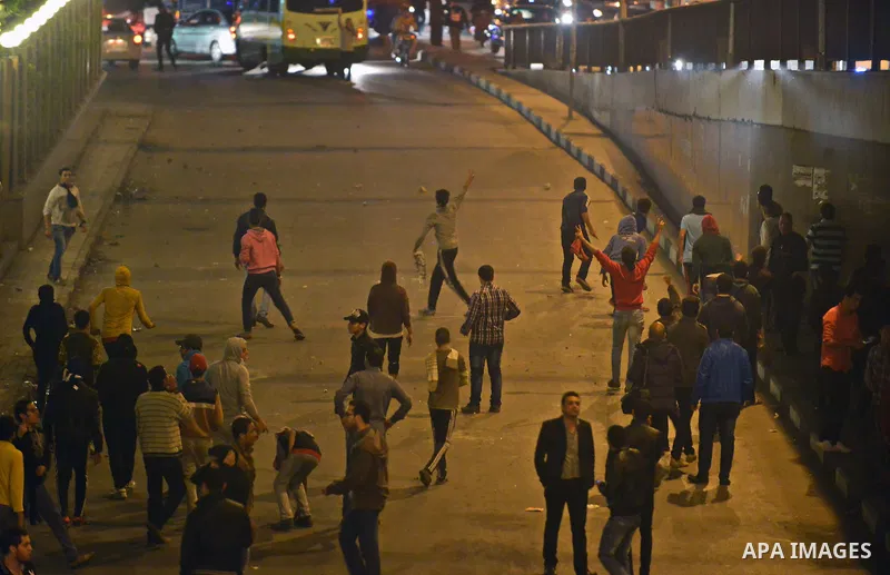Egyptian anti-Mubarak protesters clash with riot police at Abdel Moneim Riad, a main transportation hub for taxis and buses, after hearing the verdict of former Egyptian president Hosni Mubarak, in Cairo, Egypt, 29 Novem...
